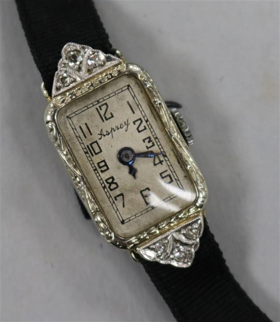 A ladys 1920s/1930s 18ct white gold and diamond set cocktail watch.
